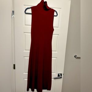 sleeveless sweater dress with a turn-down turtleneck and fully fashioned